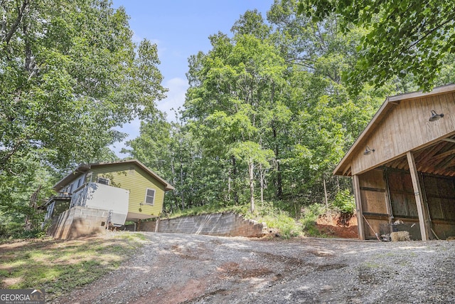 675 Wauka Ridge Rd, Clermont, GA 30527 - view of side of home featuring an outbuilding