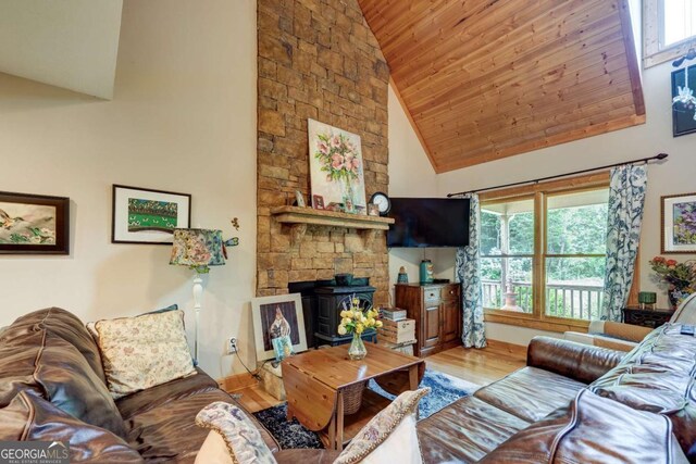 242 Noelle Ln, Dahlonega, GA 30533 - living area with wood finished floors, healthy amount of natural light, wooden ceiling, high vaulted ceiling, and a wood stove