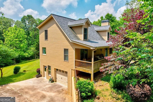242 Noelle Ln, Dahlonega, GA 30533 - view of front of property with an attached garage, a shingled roof, a front yard, a chimney, and concrete driveway
