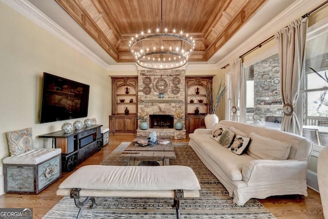 2279 Weeping Oak Dr, Braselton, GA 30517 - living room with a raised ceiling, wood ceiling, a stone fireplace, a chandelier, and wood finished floors