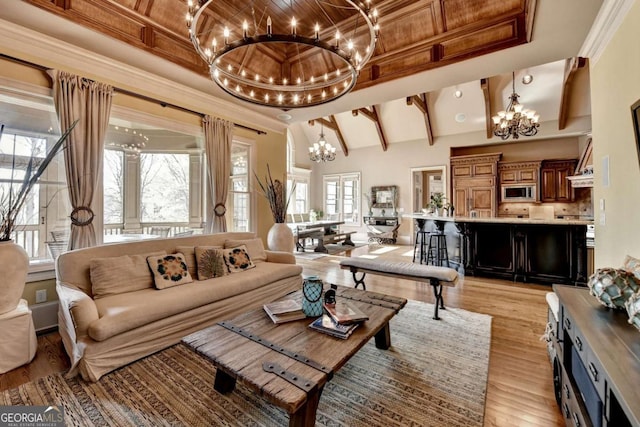 2279 Weeping Oak Dr, Braselton, GA 30517 - living area featuring a chandelier, light wood-style floors, crown molding, and beam ceiling