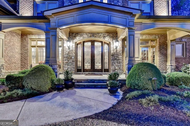2279 Weeping Oak Dr, Braselton, GA 30517 - property entrance with stone siding, french doors, and brick siding