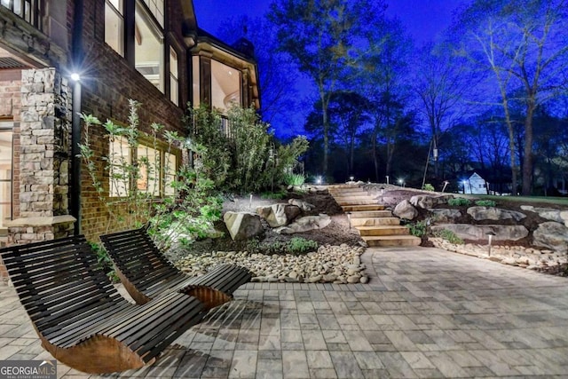 2279 Weeping Oak Dr, Braselton, GA 30517 - patio at night with a patio area
