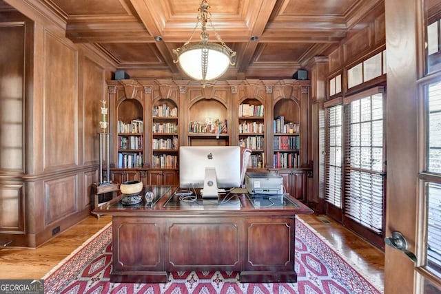 2279 Weeping Oak Dr, Braselton, GA 30517 - home office with wooden ceiling with exposed beams, built in shelves, wooden walls, wood finished floors, and crown molding