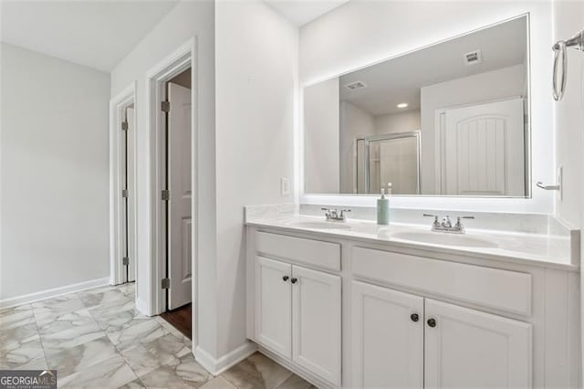 520 Edgemore Rd, Canton, GA 30114 - bathroom with double vanity, marble finish flooring, a shower stall, and baseboards
