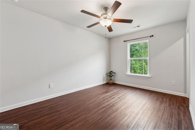 520 Edgemore Rd, Canton, GA 30114 - spare room with dark wood-style floors, baseboards, and a ceiling fan