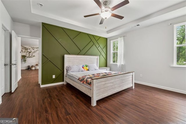 520 Edgemore Rd, Canton, GA 30114 - bedroom with a tray ceiling, wood finished floors, baseboards, and ceiling fan