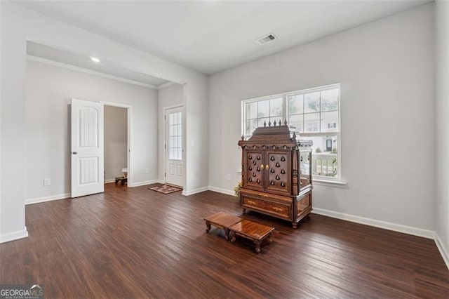 520 Edgemore Rd, Canton, GA 30114 - empty room featuring healthy amount of natural light, wood finished floors, baseboards, and crown molding