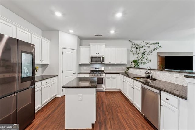 520 Edgemore Rd, Canton, GA 30114 - kitchen featuring appliances with stainless steel finishes, a sink, dark wood-style floors, white cabinets, and recessed lighting