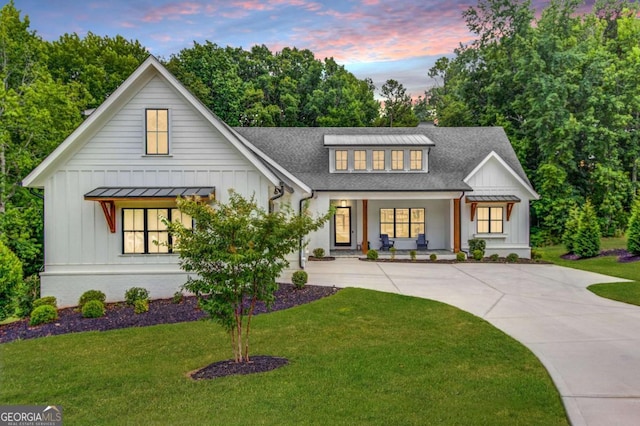 5306 Weeping Creek Trl, Flowery Branch, GA 30542 - modern farmhouse style home with board and batten siding, covered porch, driveway, and a front yard