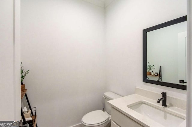 5306 Weeping Creek Trl, Flowery Branch, GA 30542 - bathroom with vanity, toilet, and baseboards