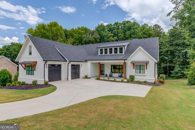 5306 Weeping Creek Trl, Flowery Branch, GA 30542 - modern farmhouse style home featuring board and batten siding, an attached garage, covered porch, and a front lawn
