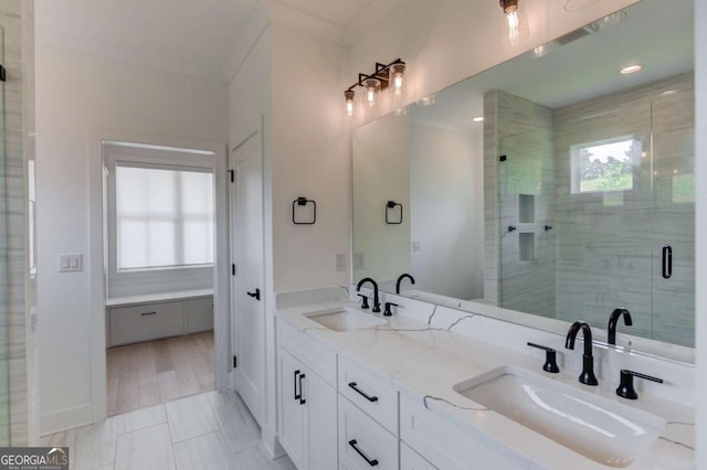 5306 Weeping Creek Trl, Flowery Branch, GA 30542 - full bath featuring healthy amount of natural light, double vanity, a stall shower, and ornamental molding