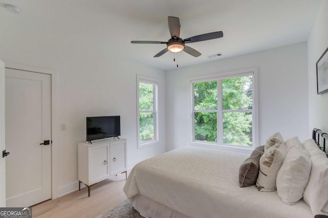 5306 Weeping Creek Trl, Flowery Branch, GA 30542 - bedroom featuring light wood-type flooring, baseboards, and ceiling fan