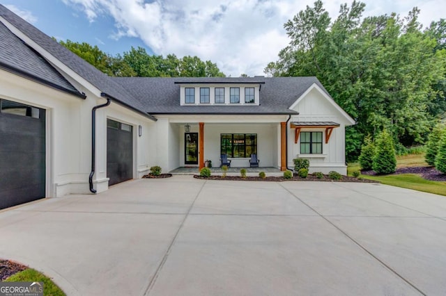 5306 Weeping Creek Trl, Flowery Branch, GA 30542 - modern farmhouse style home with a garage, covered porch, concrete driveway, board and batten siding, and roof with shingles