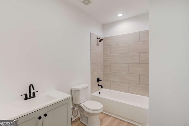 5306 Weeping Creek Trl, Flowery Branch, GA 30542 - bathroom featuring wood finished floors, shower / washtub combination, and vanity