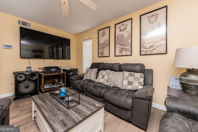 141 Stoneridge Dr, Warner Robins, GA 31088 - living area featuring light wood finished floors, baseboards, and a ceiling fan