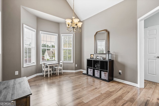 167 Maggies Pt, Dallas, GA 30132 - dining space with lofted ceiling, a chandelier, and wood finished floors