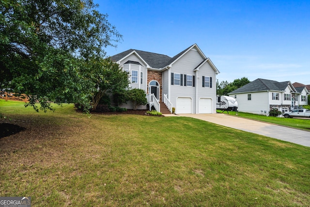 167 Maggies Pt, Dallas, GA 30132 - view of front of home featuring driveway, an attached garage, and a front yard