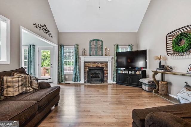 167 Maggies Pt, Dallas, GA 30132 - living room featuring high vaulted ceiling, wood-type flooring, and a fireplace