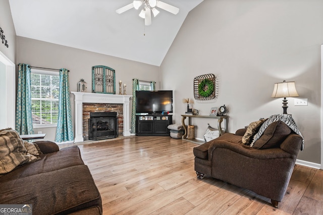 167 Maggies Pt, Dallas, GA 30132 - living room featuring a ceiling fan, high vaulted ceiling, light wood-style flooring, and a fireplace