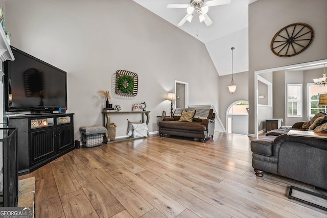 167 Maggies Pt, Dallas, GA 30132 - living area featuring high vaulted ceiling, ceiling fan, hardwood / wood-style floors, and a chandelier