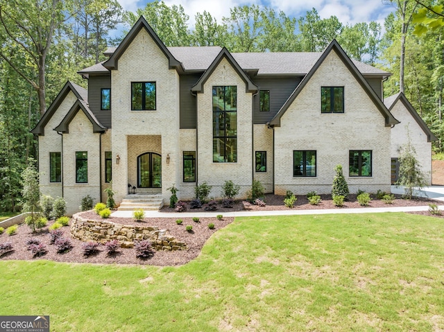 4235 Drew Campground Rd, Alpharetta, GA 30004 - french provincial home featuring a front lawn and brick siding