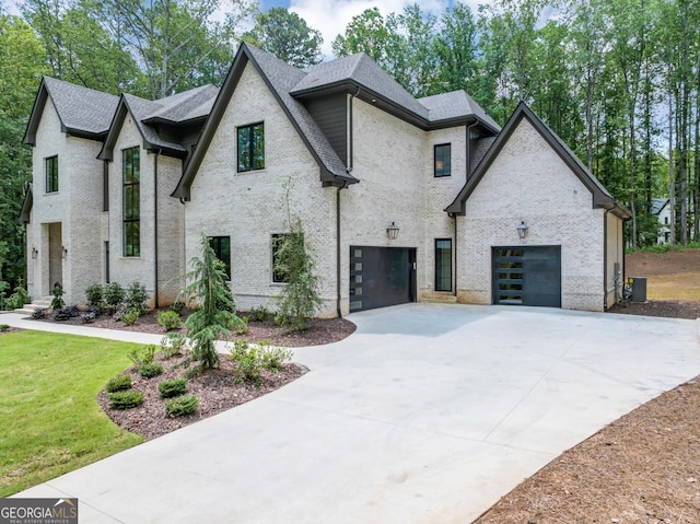 4235 Drew Campground Rd, Alpharetta, GA 30004 - view of front of house featuring driveway, a shingled roof, brick siding, and a garage
