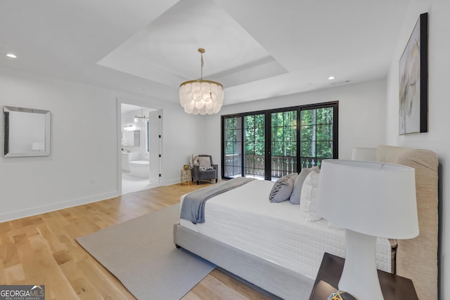4235 Drew Campground Rd, Alpharetta, GA 30004 - bedroom featuring a raised ceiling, recessed lighting, wood finished floors, a chandelier, and connected bathroom
