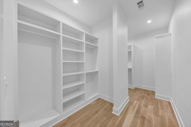 4235 Drew Campground Rd, Alpharetta, GA 30004 - walk in closet featuring wood finished floors