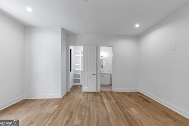 4235 Drew Campground Rd, Alpharetta, GA 30004 - unfurnished bedroom with a spacious closet, light wood-style flooring, recessed lighting, and ensuite bathroom