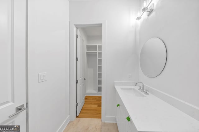 4235 Drew Campground Rd, Alpharetta, GA 30004 - bathroom with vanity and a spacious closet