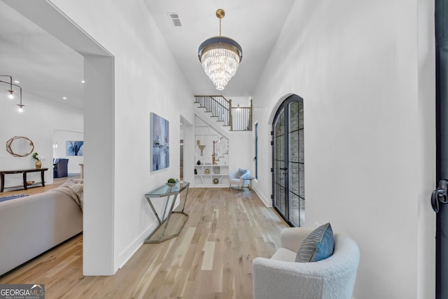4235 Drew Campground Rd, Alpharetta, GA 30004 - foyer entrance featuring wood finished floors and a chandelier