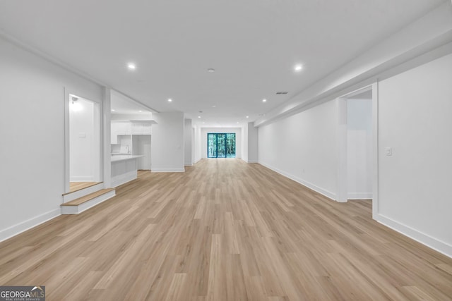 4235 Drew Campground Rd, Alpharetta, GA 30004 - unfurnished living room with light wood-type flooring and recessed lighting