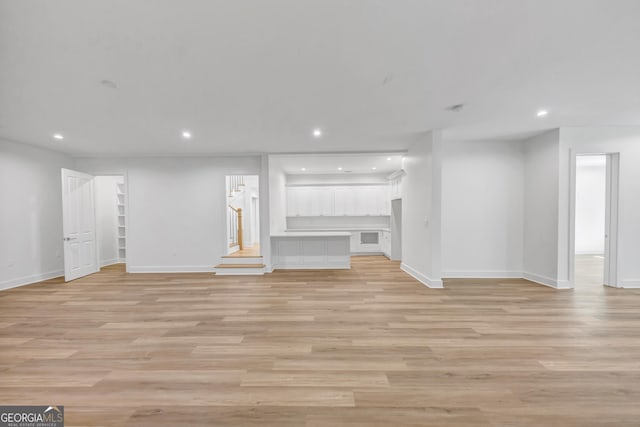 4235 Drew Campground Rd, Alpharetta, GA 30004 - unfurnished living room featuring recessed lighting and light wood finished floors