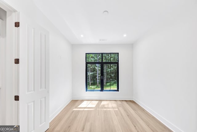 4235 Drew Campground Rd, Alpharetta, GA 30004 - spare room featuring light wood-type flooring and recessed lighting
