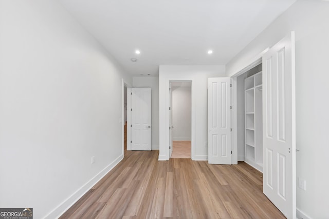 4235 Drew Campground Rd, Alpharetta, GA 30004 - unfurnished bedroom with light wood finished floors, recessed lighting, a walk in closet, and a closet