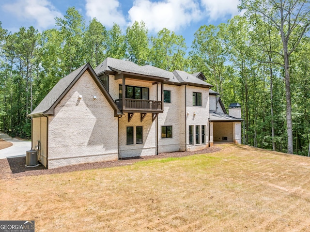 4235 Drew Campground Rd, Alpharetta, GA 30004 - back of property featuring a balcony, brick siding, a lawn, and a chimney