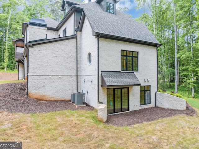 4235 Drew Campground Rd, Alpharetta, GA 30004 - back of property featuring brick siding, a shingled roof, and a yard