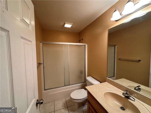 105 Whitehead Rd Unit 10, Athens, GA 30606 - full bath with vanity, tile patterned floors, toilet, and bath / shower combo with glass door