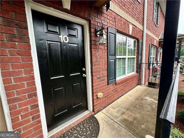 105 Whitehead Rd Unit 10, Athens, GA 30606 - property entrance featuring brick siding and covered porch
