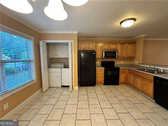 105 Whitehead Rd Unit 10, Athens, GA 30606 - kitchen with black appliances, separate washer and dryer, a sink, light countertops, and crown molding