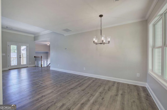 315 Arbor Cir, Rockmart, GA 30153 - unfurnished living room with wood finished floors, a chandelier, ornamental molding, baseboards, and french doors