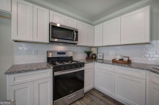 315 Arbor Cir, Rockmart, GA 30153 - kitchen with stainless steel appliances, white cabinetry, light stone countertops, and crown molding