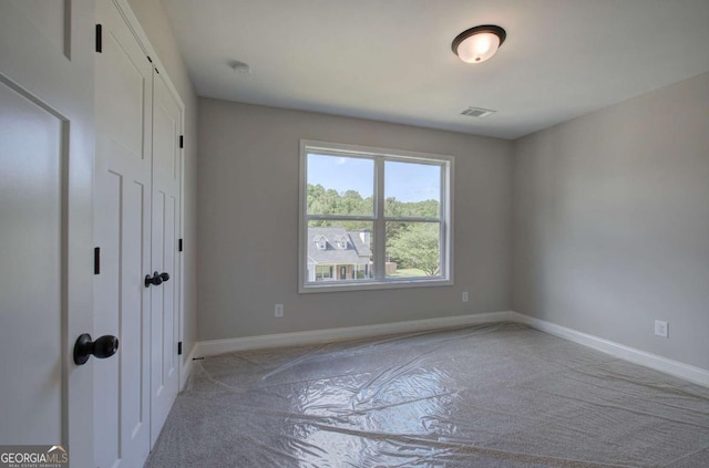 315 Arbor Cir, Rockmart, GA 30153 - unfurnished bedroom with baseboards and light colored carpet
