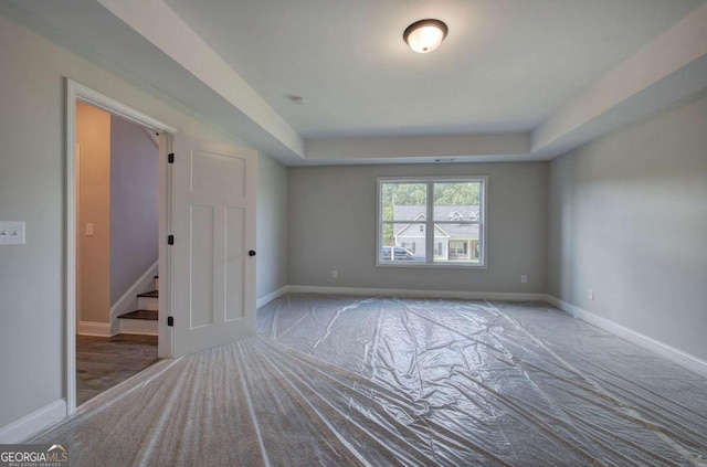315 Arbor Cir, Rockmart, GA 30153 - unfurnished room featuring baseboards, a tray ceiling, and carpet