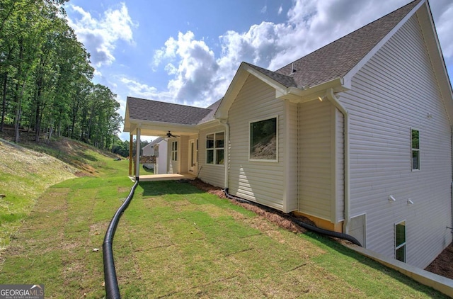 315 Arbor Cir, Rockmart, GA 30153 - rear view of house featuring a yard, ceiling fan, and roof with shingles
