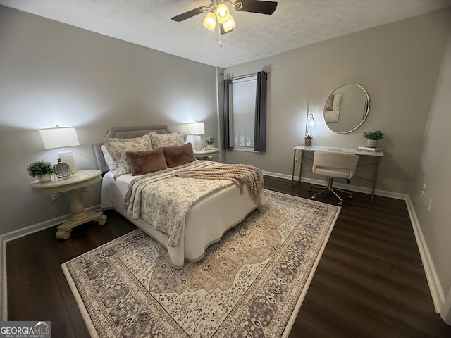 3915 Woodridge Way, Tucker, GA 30084 - bedroom featuring wood finished floors, a textured ceiling, and ceiling fan