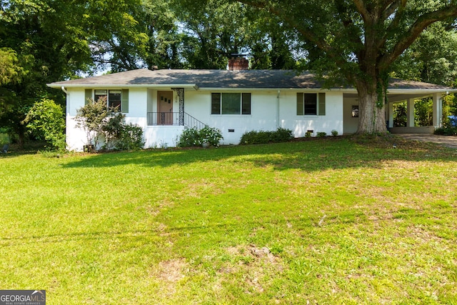 256 4th Ave, Winder, GA 30680 - ranch-style home with a front yard, a carport, a chimney, and driveway