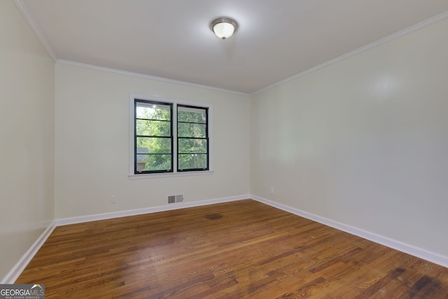 256 4th Ave, Winder, GA 30680 - spare room featuring wood finished floors and crown molding